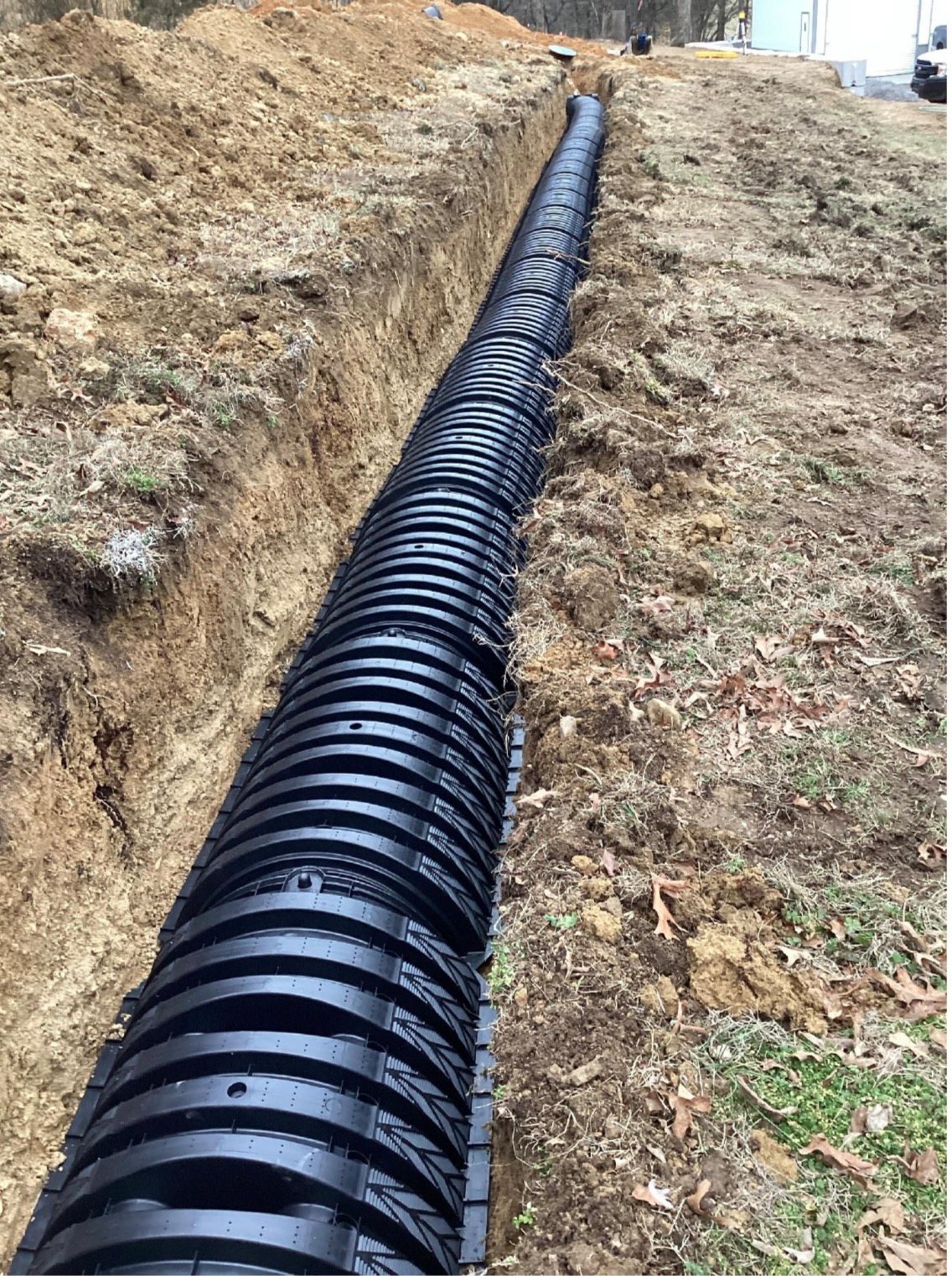 Drainage pipe installed in a trench on a BECS project