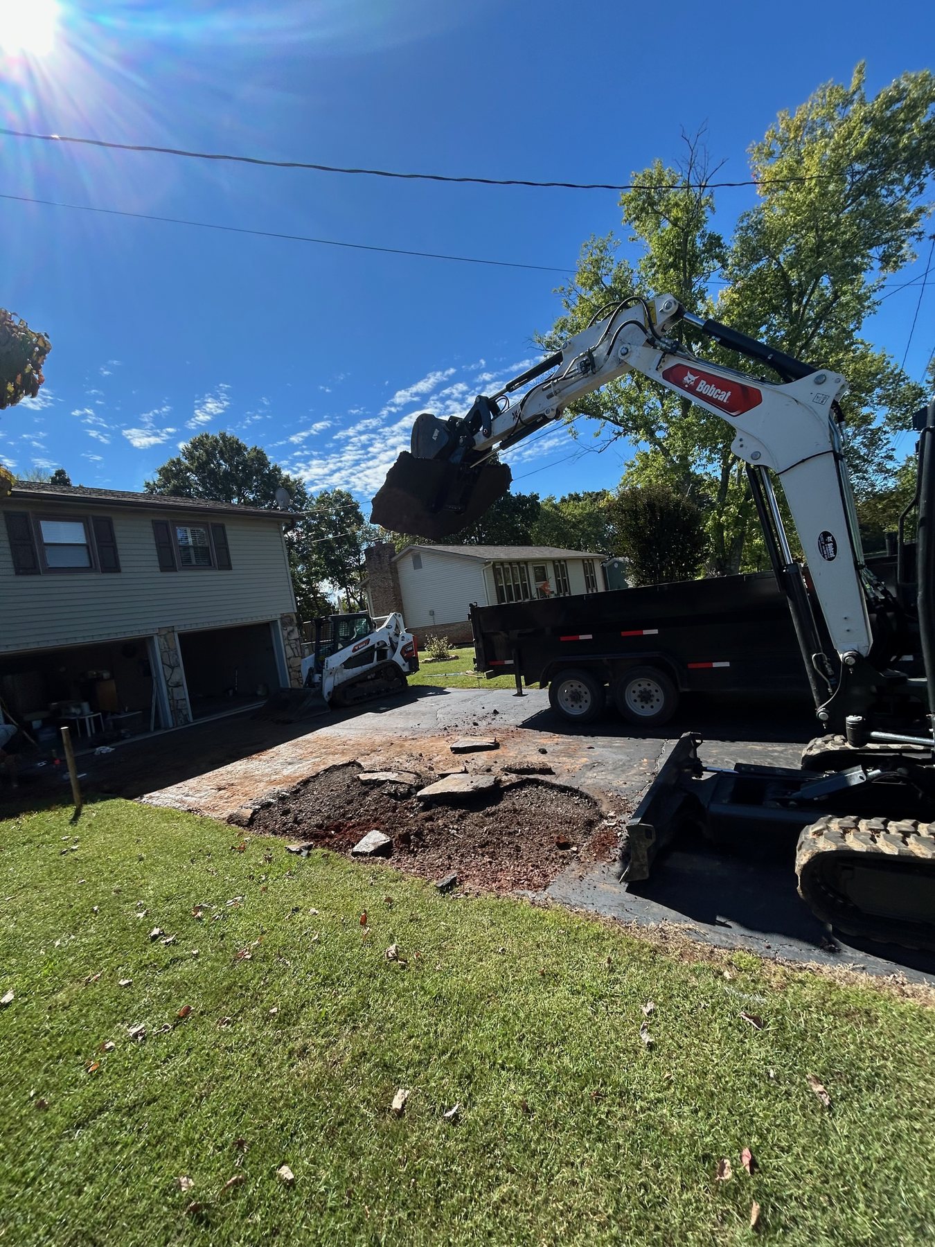 BECS equipment loading debris during a tear-out job