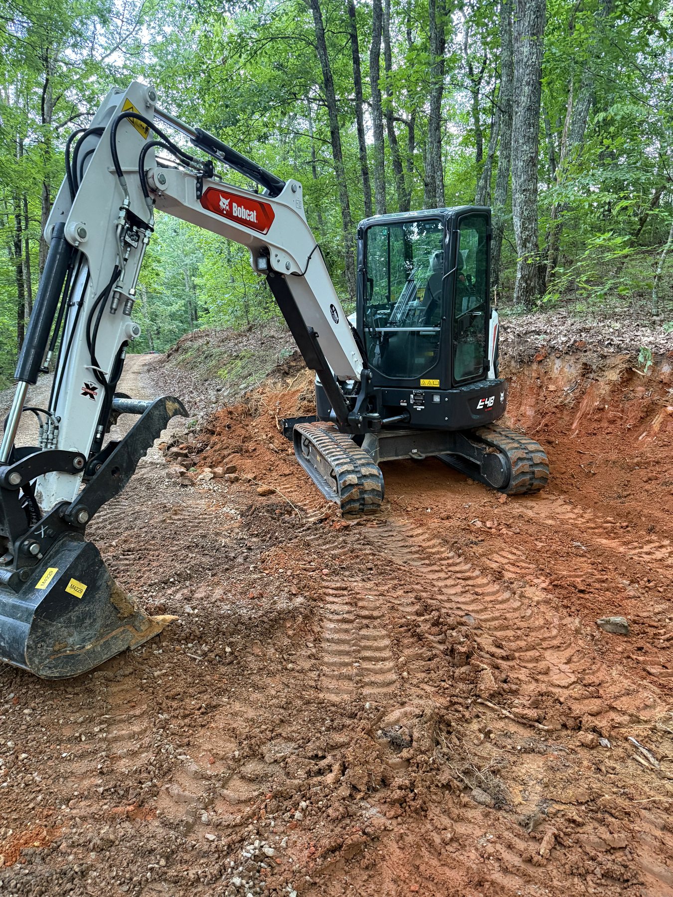 BECS excavator preparing a red clay jobsite