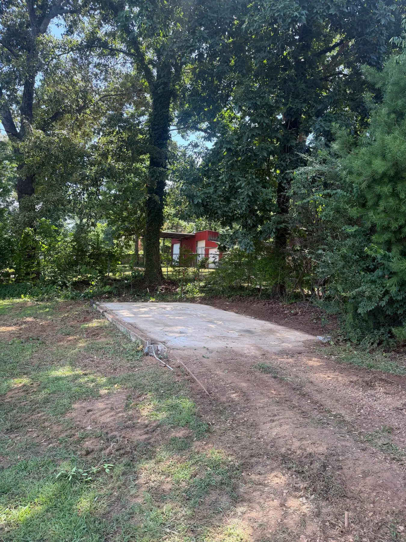 Exposed concrete slab after removal of a small outbuilding